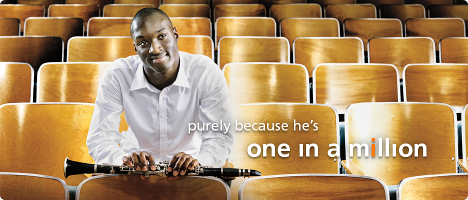 Teen, living with factor XIII A-subunit deficiency, seated with his clarinet in an auditorium